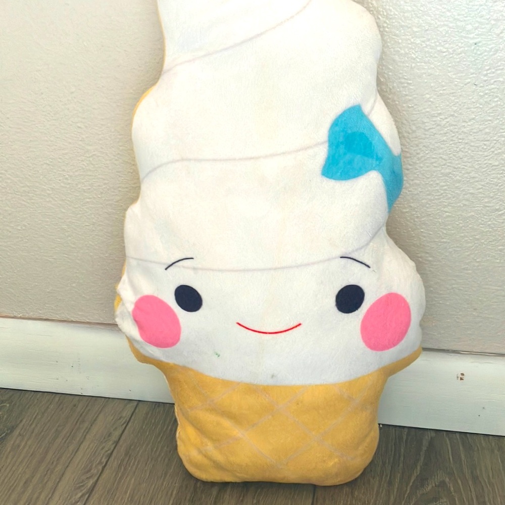 Vanilla ice cream cone with blue bow blushing